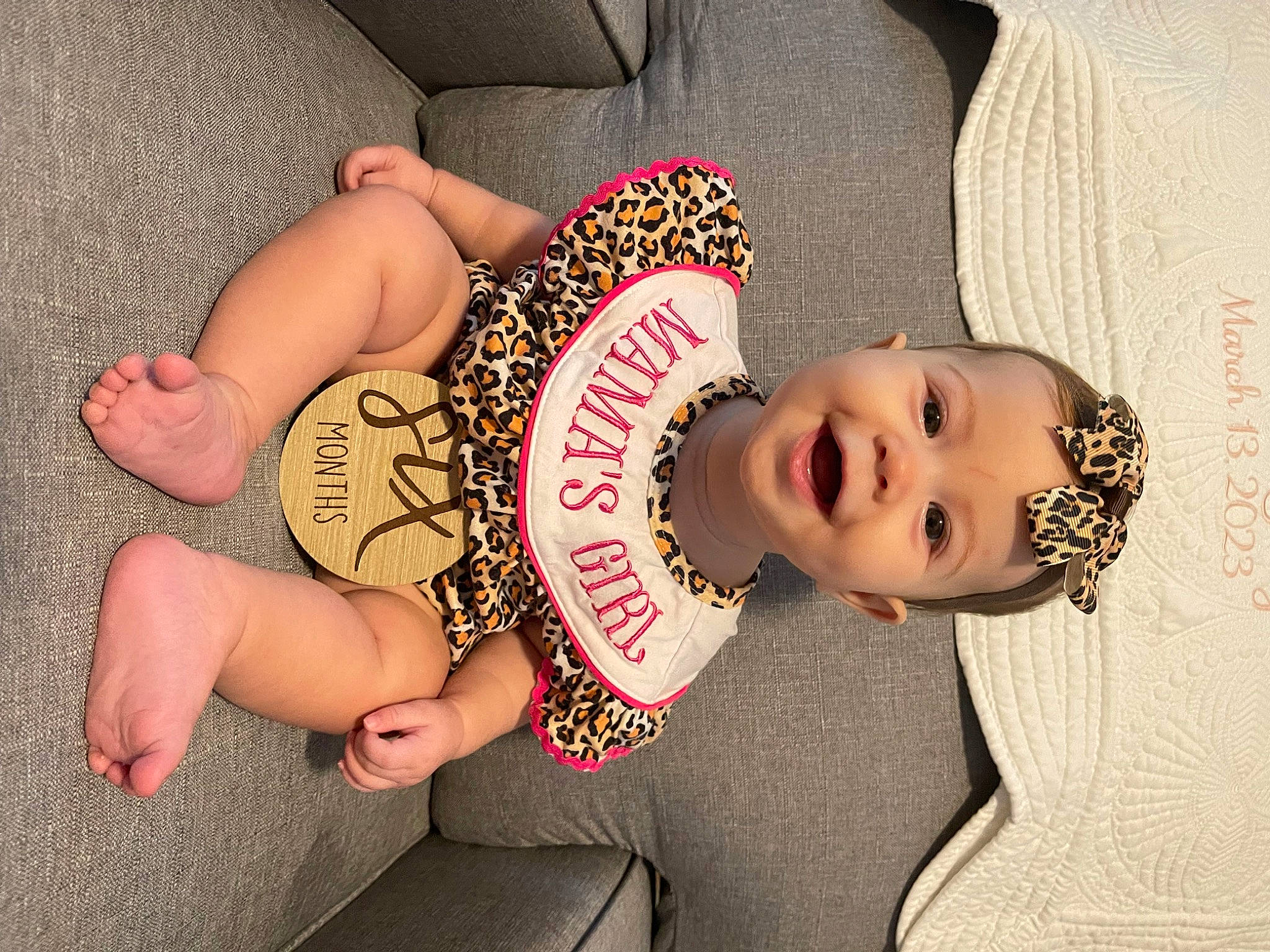 Madeline is registered to the contest to win money with this photo: black_hair, elbow, eye, finger, hand, happy, hat, head, headgear, human_body, joint, leg, nail, neck, person, pink, skin, textile, thigh, toddler