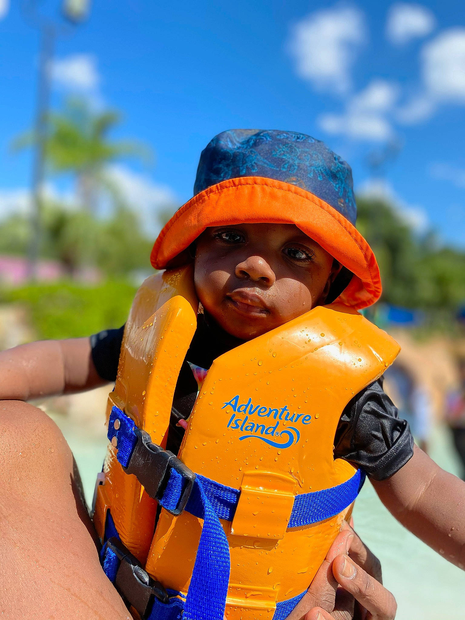 Tj is registered to the contest to win money with this photo: blue, body_of_water, cap, cloud, electric_blue, eyewear, fashion_accessory, fun, glove, happy, headwear, landscape, leisure, lifejacket, orange, person, personal_protective_equipment, recreation, sky, sun_hat