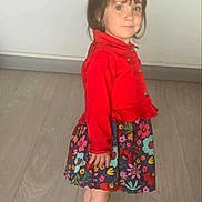 Rihanna participe au concours pour gagner de l'argent avec cette photo : barefoot, casual_clothing, child, curious, cute, flooring, floral_skirt, indoor, innocent, person, portrait, red_jacket, short_hair, side_view, small_child, standing, toddler, wall, wooden_floor, young_child