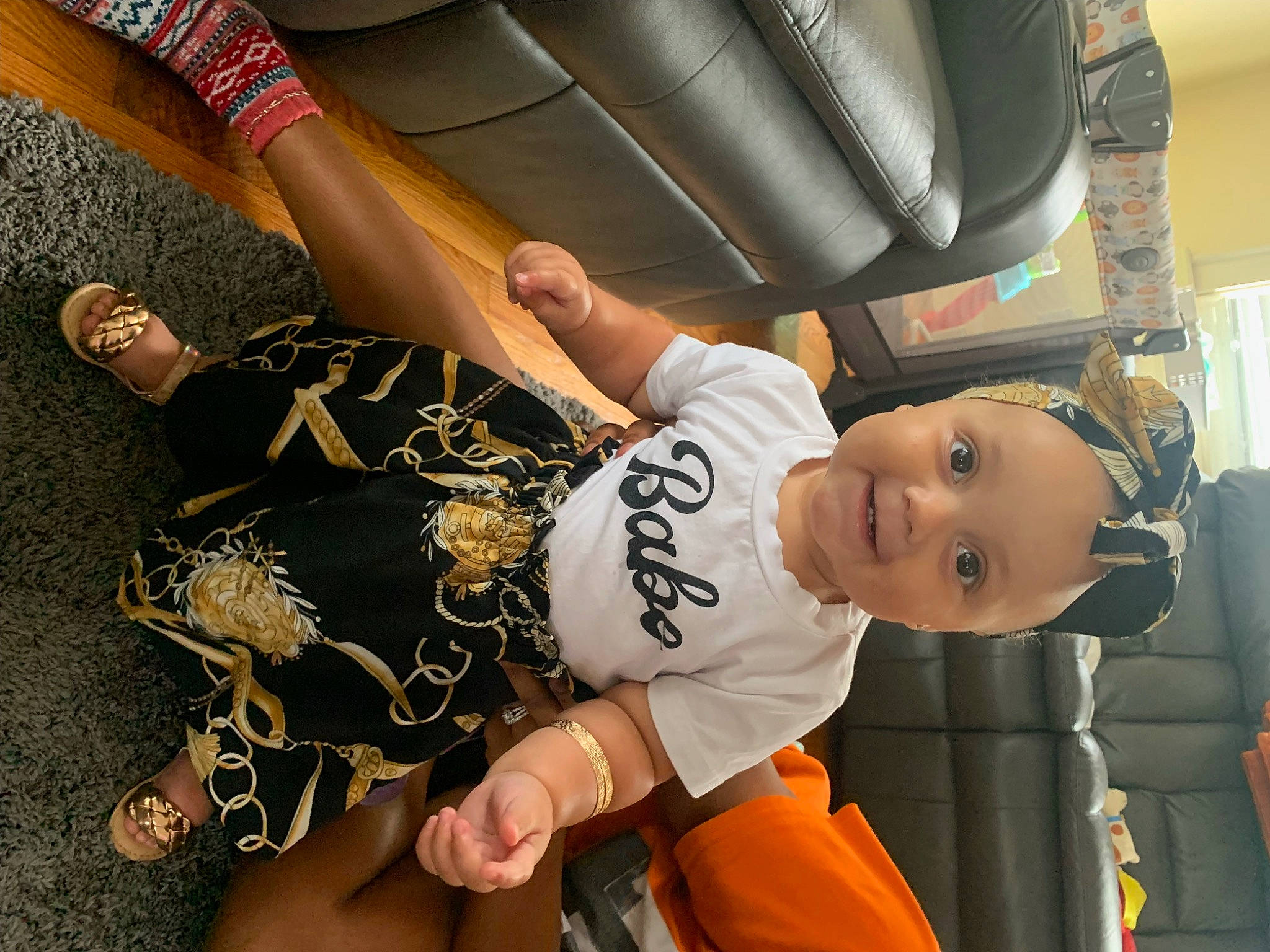Aliyah is registered to the contest to win money with this photo: auto_part, automotive_design, car_seat, child, elbow, family_car, flooring, fun, gesture, happy, headwear, human_leg, joint, knee, luxury_vehicle, person, sportswear, t_shirt, thigh, toddler