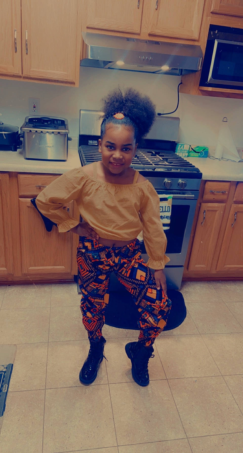 Taliyah joined the competition — help win amazing prizes! blue, cabinetry, child, cooktop, countertop, drawer, electric_blue, eye, flooring, home_appliance, homemaker, joy, kitchen, kitchen_appliance, major_appliance, person, refrigerator, room, smile, standing