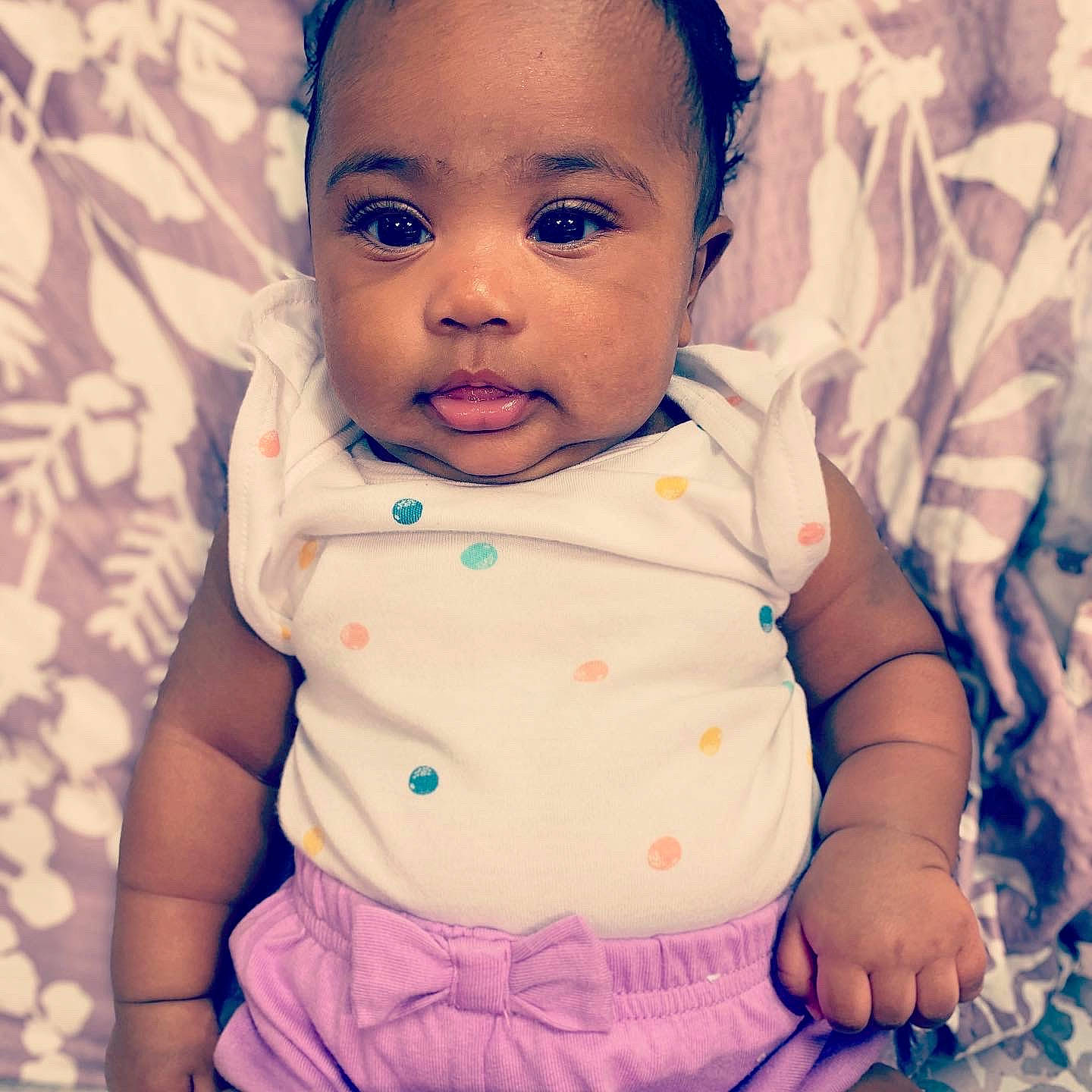 Amaya is registered to the contest to win money with this photo: azure, baby, baby_toddler_clothing, cheek, collar, eye, eyelash, face, gesture, hair, happy, head, lip, neck, nose, person, pink, product, skin, sleeve