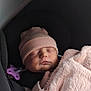 baby, sleeping, infant, pink_blanket, pink_hat, car_seat, pacifier, child, cute, soft_texture, peaceful, resting, newborn, portrait, indoors, warm, cozy, wrapped, small_hand, closed_eyes