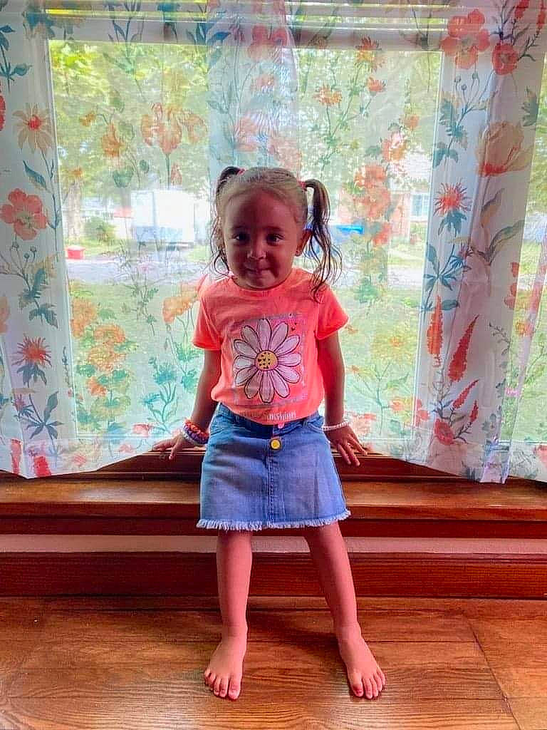 Legacy is registered to the contest to win money with this photo: baby_toddler_clothing, barefoot, child, flooring, happy, hardwood, human_leg, magenta, pattern, peach, person, pink, purple, sleeve, smile, textile, toddler, trunk, waist, wood