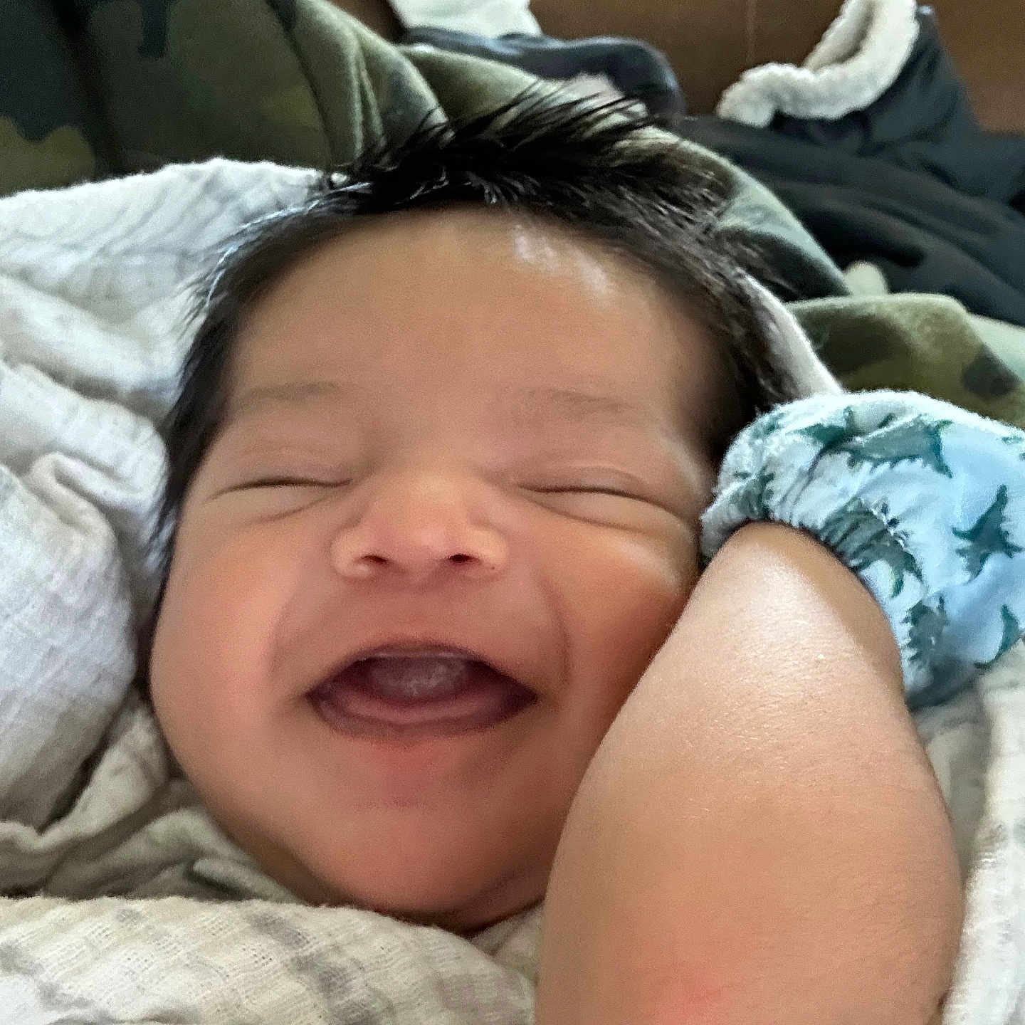 Mauricio is registered to the contest to win money with this photo: baby, bed, blanket, bodypart, couch, cushion, face, furniture, happy, head, homedecor, laughing, mouth, newborn, person, photography, portrait, quilt, sleeping, smile