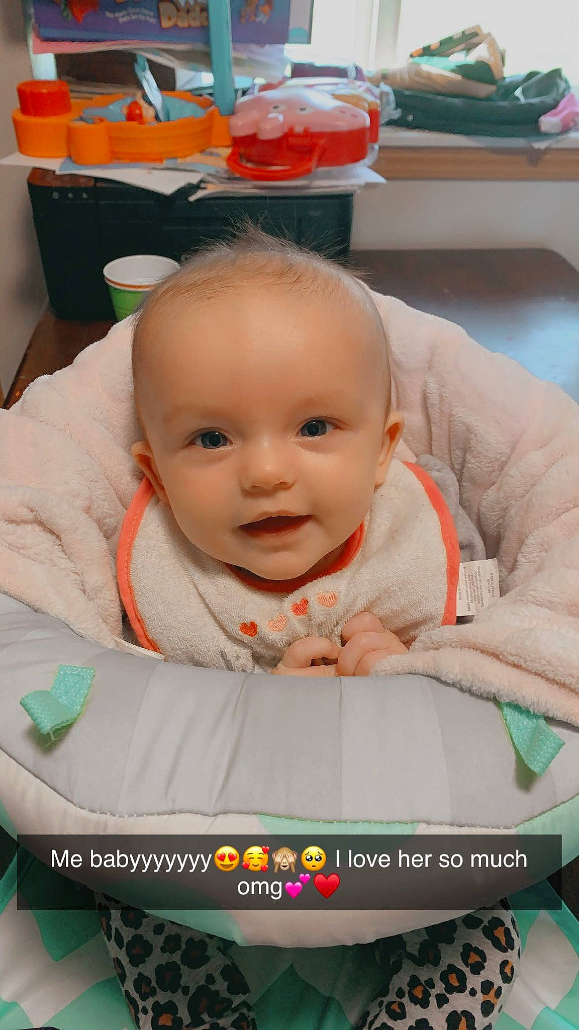 Lucille is registered to the contest to win money with this photo: baby, baby_carriage, baby_products, baby_safety, baby_toddler_clothing, baby_toys, cheek, child, comfort, flooring, fun, happy, leisure, person, photo_caption, play, room, sitting, skin, smile