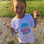 Arielle is registered to the contest to win money with this photo: bodypart, child, clothing, face, female, finger, footwear, girl, grass, hand, head, nature, outdoors, person, photography, plant, portrait, shoe, shorts, t_shirt