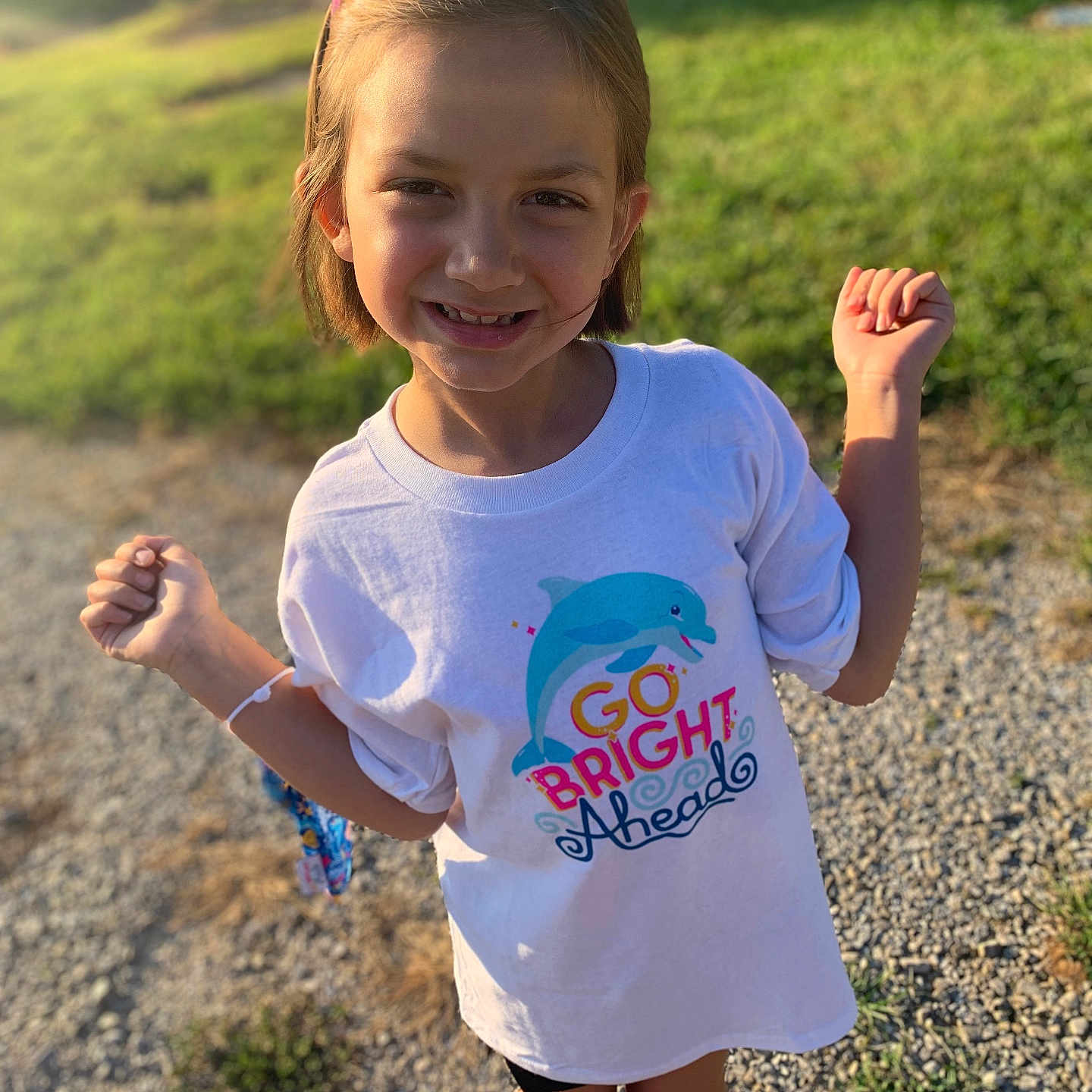 Arielle is registered to the contest to win money with this photo: bodypart, child, clothing, face, female, finger, footwear, girl, grass, hand, head, nature, outdoors, person, photography, plant, portrait, shoe, shorts, t_shirt