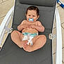baby, pacifier, diaper, chair, outdoor, happy, smiling, infant, cute, relaxed, child, skin, legs, hands, head, hair, footwear_none, mesh, seat, playful
