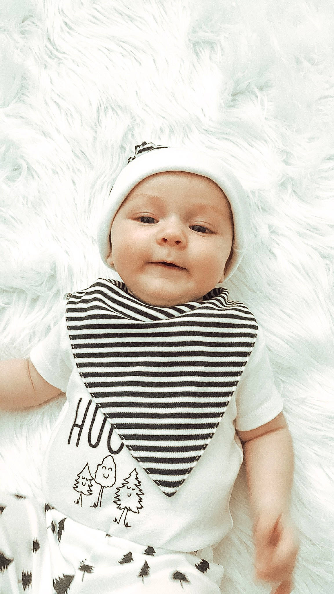 Madden is registered to the contest to win money with this photo: baby, baby_products, cheek, child, child_model, face, fashion_accessory, head, headgear, person, photography, portrait_photography, product, skin, smile, toddler, white