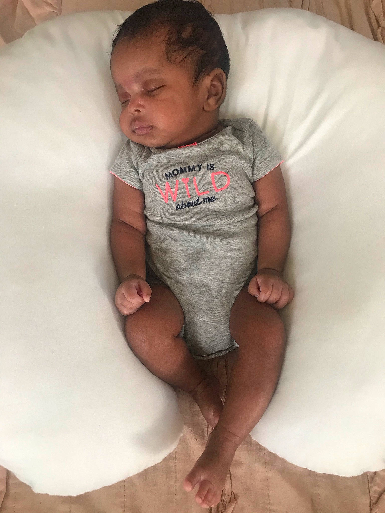 Koi is registered to the contest to win money with this photo: ankle, baby, baby_products, baby_toddler_clothing, barefoot, bed_sheet, bedding, bedtime, cheek, child, comfort, finger, foot, linens, nightwear, person, skin, sole, stomach, toddler