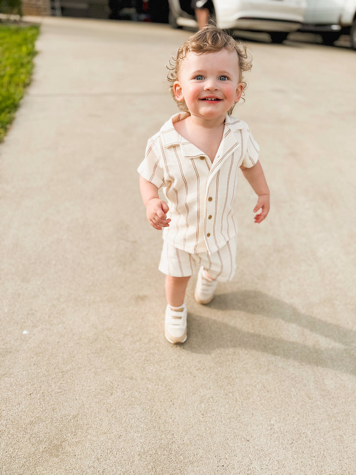 Casen joined the competition — help win amazing prizes! baby, car, city, clothing, dress, face, happy, head, pants, person, photography, portrait, road, sleeve, smile, street, transportation, urban, vehicle, walking