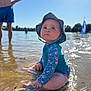Rose participe au concours pour gagner de l'argent avec cette photo : baby, child, water, beach, sun_hat, swimsuit, sitting, sunny, outdoor, blue_sky, water_reflection, person, summer, shallow_water, nature, vacation, family, holiday, happy, daytime
