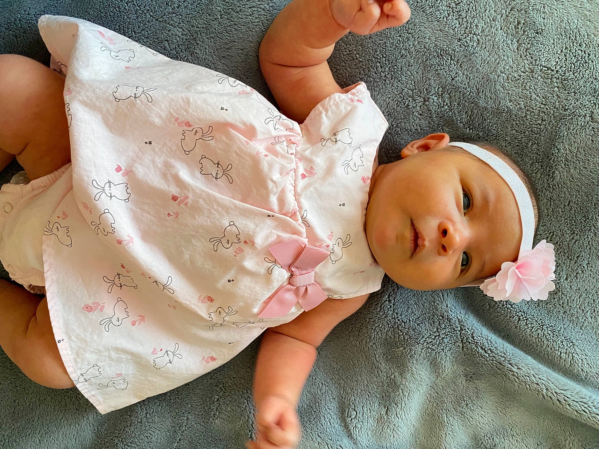 Maxine is registered to the contest to win money with this photo: arm, baby, baby_toddler_clothing, cheek, comfort, doll, eyelash, finger, hand, headgear, headwear, human_body, joint, lip, nail, neck, person, pink, skin, sleeve