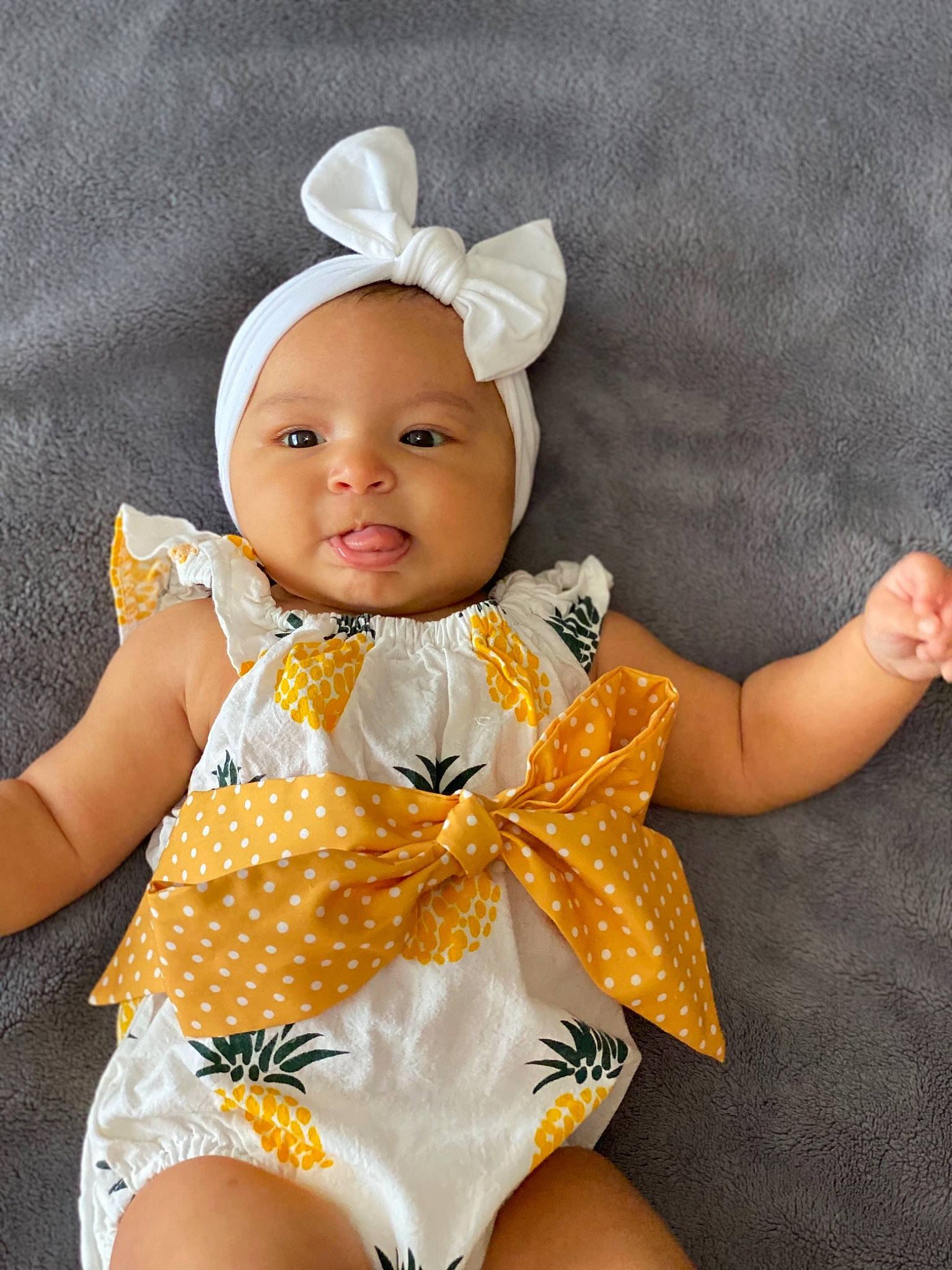 Maxine is registered to the contest to win money with this photo: baby, baby_products, baby_toddler_clothing, child, costume_hat, eye, face, fashion_accessory, happy, head, headband, headgear, headpiece, headwear, pattern, person, skin, sleeve, smile, thigh