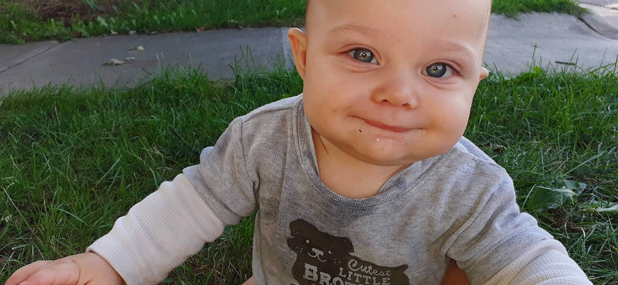 Brayson is registered to the contest to win money with this photo: baby, baby_toddler_clothing, cheek, chin, eyelash, finger, grass, happy, iris, joy, lip, mouth, nose, people_in_nature, person, plant, skin, sleeve, smile, t_shirt