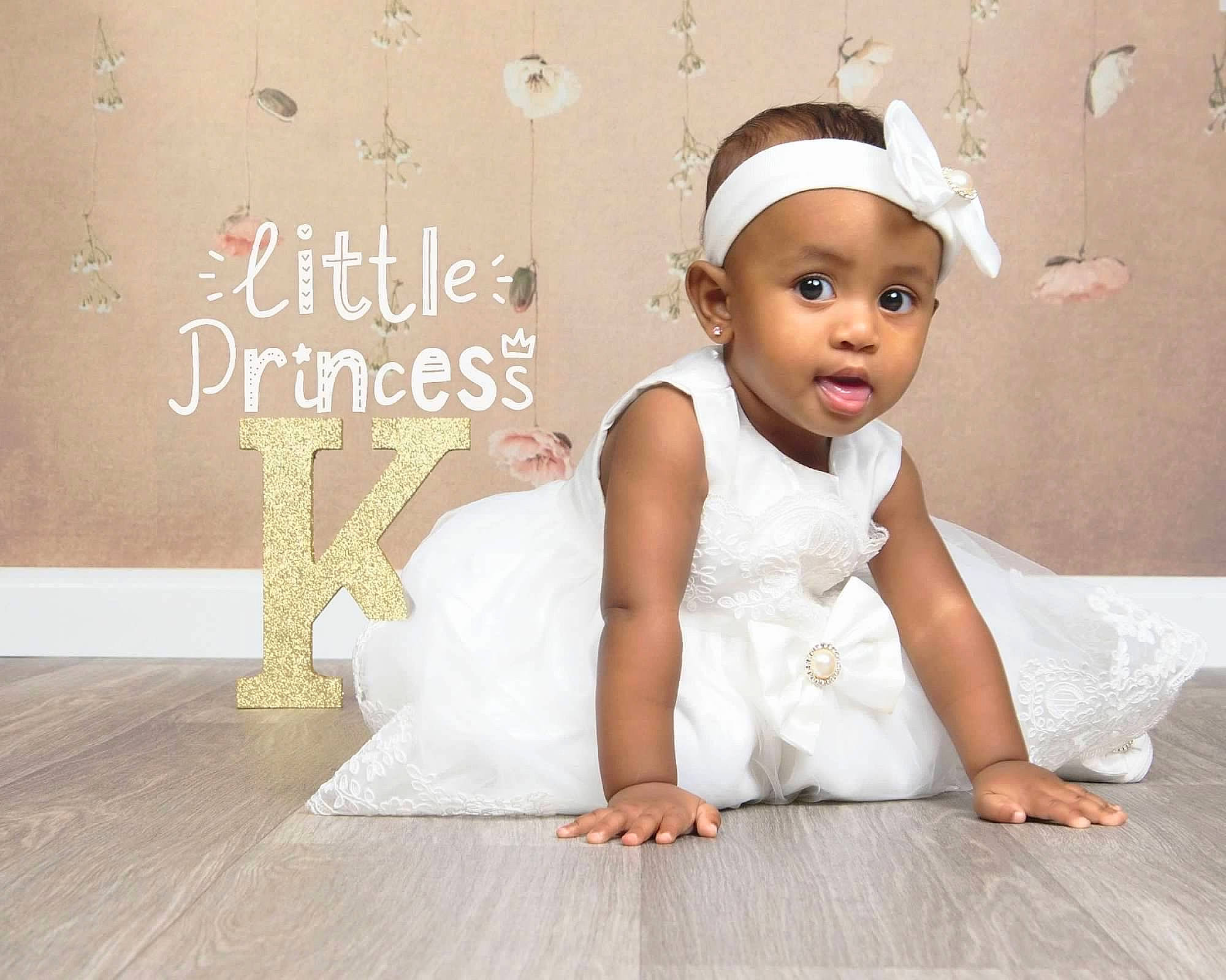 Karoline joined the competition — help win amazing prizes! baby, baby_toddler_clothing, child, dress, fashion_accessory, flash_photography, floor, flooring, font, happy, hardwood, headpiece, pattern, person, product, sitting, skin, sleeve, smile, surprise