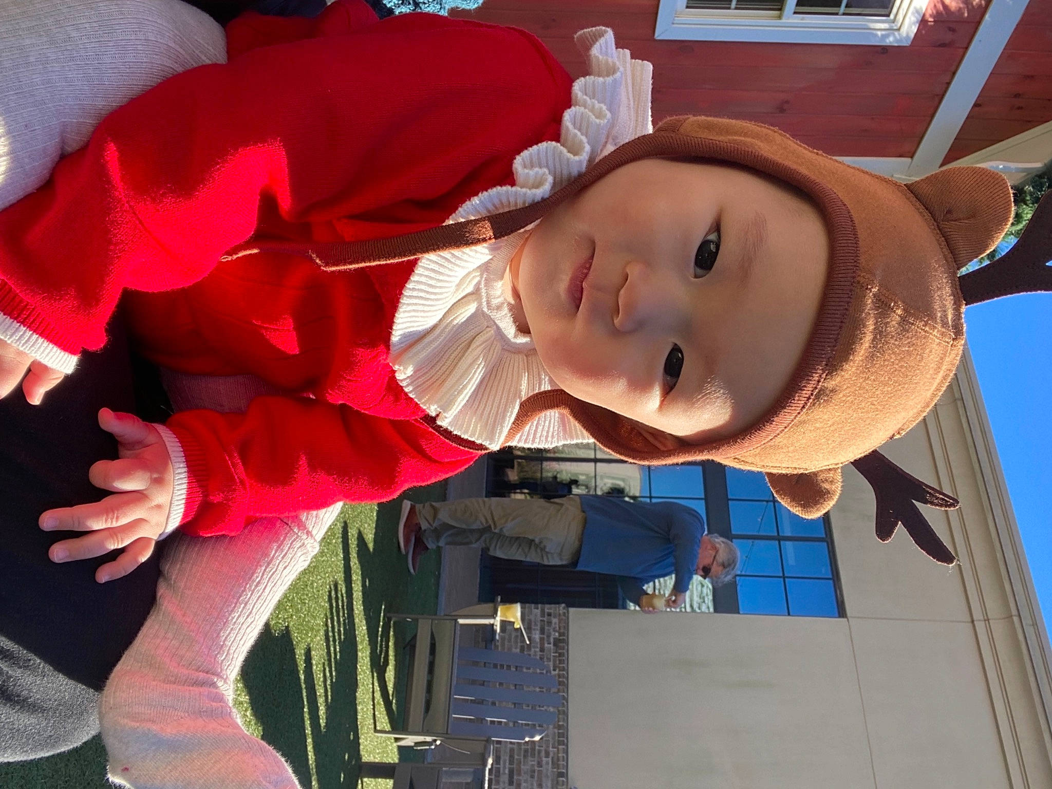 Joy is registered to the contest to win money with this photo: baby, baby_products, carmine, child, costume_hat, event, fictional_character, fun, happy, hat, headgear, headwear, leisure, magenta, person, smile, sun_hat, toddler, tree, winter