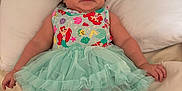 Auriel is registered to the contest to win money with this photo: baby, infant, tutu, dress, headband, bow, pillow, blanket, bed, smile, cute, child, clothing, fabric, person, indoors, soft, skin, legs, socks