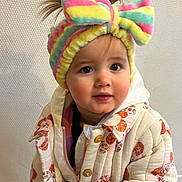 Andriana participe au concours pour gagner de l'argent avec cette photo : toddler, child, headband, colorful, bow, jacket, quilted_jacket, floral_pattern, indoor, curious_eyes, cute, baby, person, portrait, warm_clothing, fashion, expression, face, hair, standing