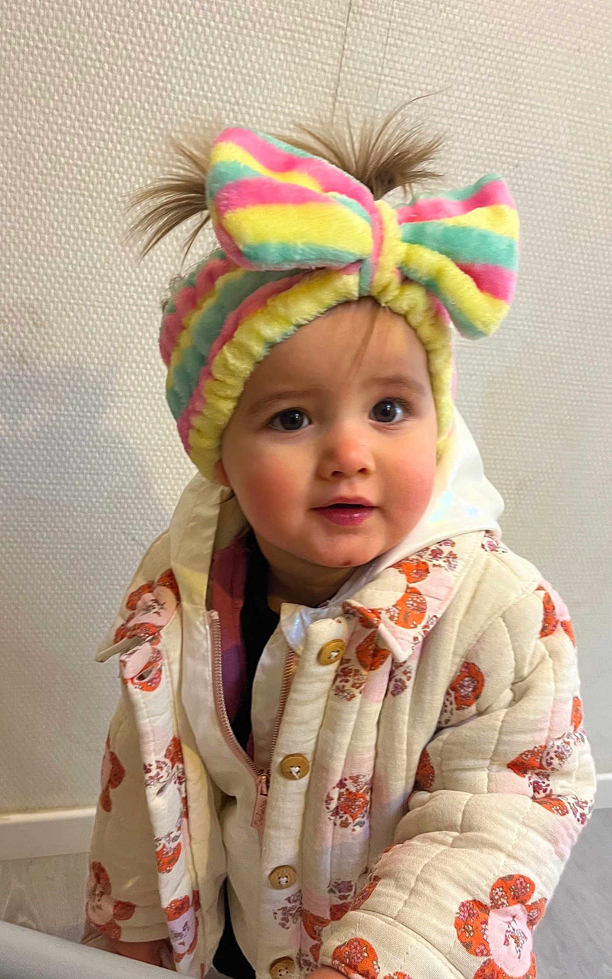 Andriana participe au concours pour gagner de l'argent avec cette photo : toddler, child, headband, colorful, bow, jacket, quilted_jacket, floral_pattern, indoor, curious_eyes, cute, baby, person, portrait, warm_clothing, fashion, expression, face, hair, standing