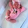 Ameiire joined the competition — help win amazing prizes! baby, sleeping, pink_onesie, headband, bow, pacifier, infant, cute, resting, newborn, indoors, closeup, soft_lighting, peaceful, child, face, hands, feet, fabric, texture