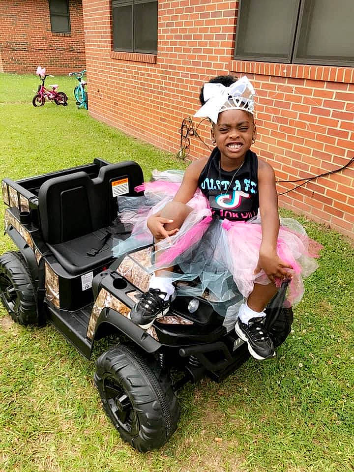 Dakota joined the competition — help win amazing prizes! auto_part, automotive_design, automotive_exterior, automotive_tire, automotive_wheel_system, bumper, fender, fun, grass, headwear, lawn, lawn_mower, motor_vehicle, mower, person, recreation, rolling, tire, tread, vehicle