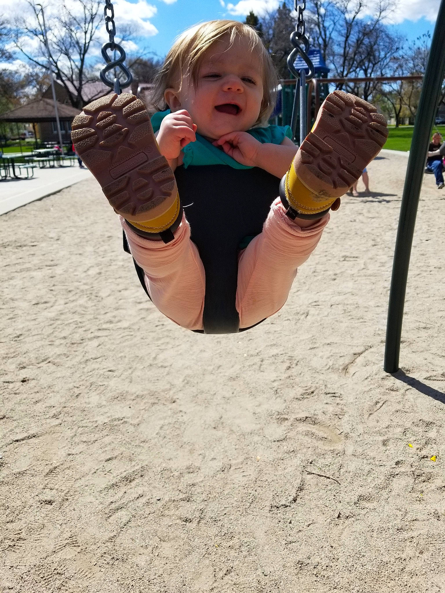 Kynley joined the competition — help win amazing prizes! blond, child, city, flip_acrobatic, fun, leg, outdoor_play_equipment, person, play, playground, public_space, sportswear, swing, toddler, tree, vacation