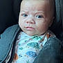 Jaden participe au concours pour gagner de l'argent avec cette photo : baby, infant, car_seat, onesie, turtle_pattern, child, face, eyes, clothing, seatbelt, straps, closeup, safety, warning_label, indoor, person, expression, head, skin, cute