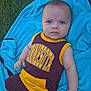 baby, infant, child, towel, grass, outdoor, clothing, maroon, yellow, person, portrait, cute, summer, blue, barefoot, relaxing, looking, young, skin, casual