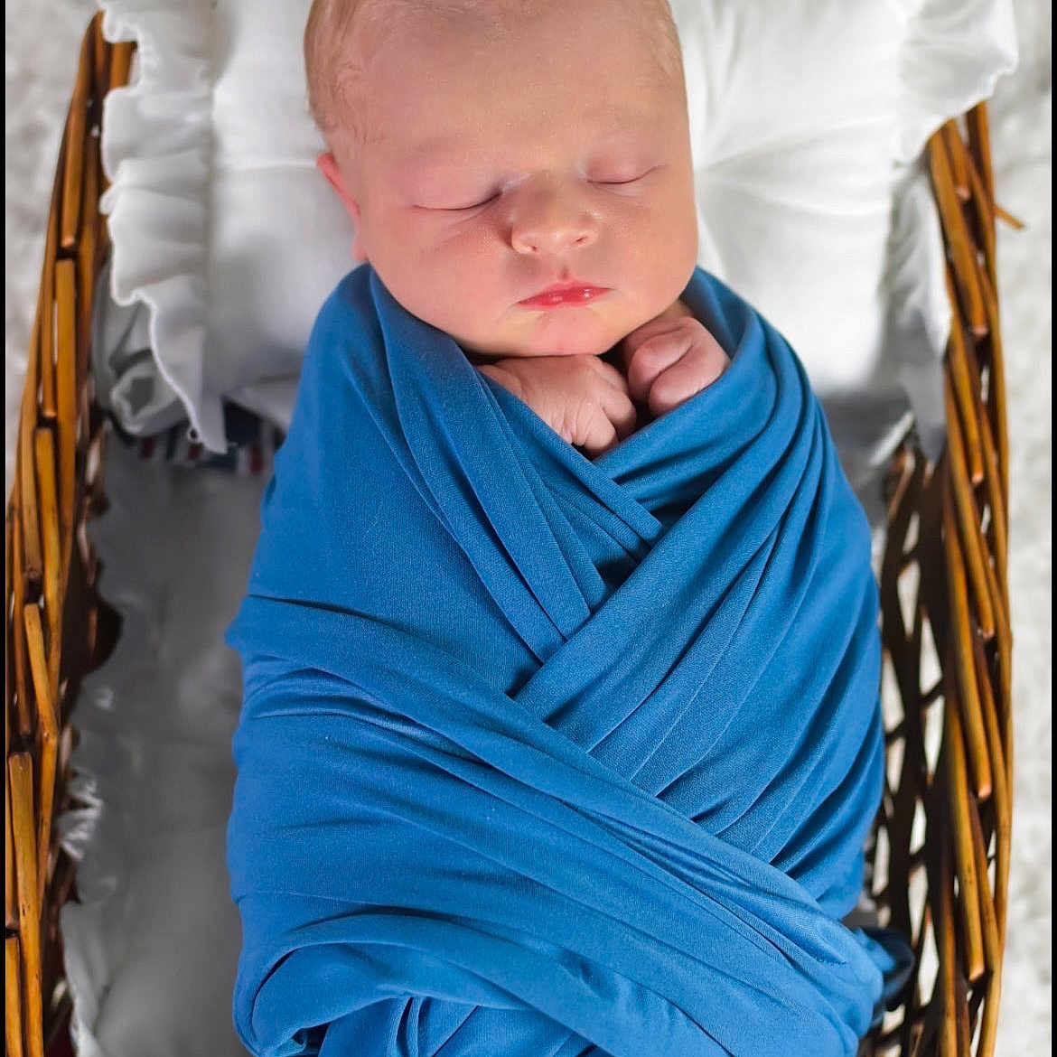 Kolte is registered to the contest to win money with this photo: baby, blanket, blue_blanket, child, closeup, cozy, cute, indoors, infant, newborn, newborn_baby, peaceful, pillow, portrait, resting, sleeping, soft, swaddled, wicker_basket, wrapped