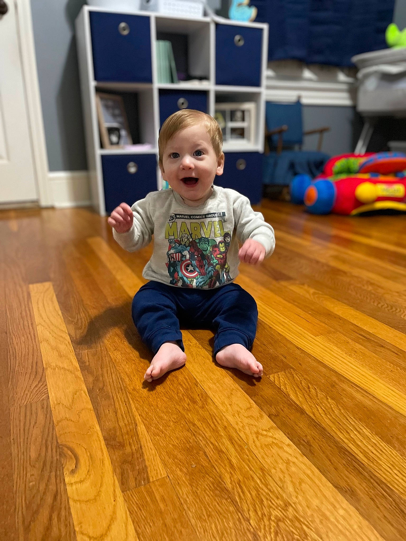 Raymond joined the competition — help win amazing prizes! baby_toddler_clothing, child, floor, flooring, fun, hardwood, laminate_flooring, leisure, person, plank, plywood, room, sitting, smile, standing, surprise, t_shirt, toddler, varnish, wood