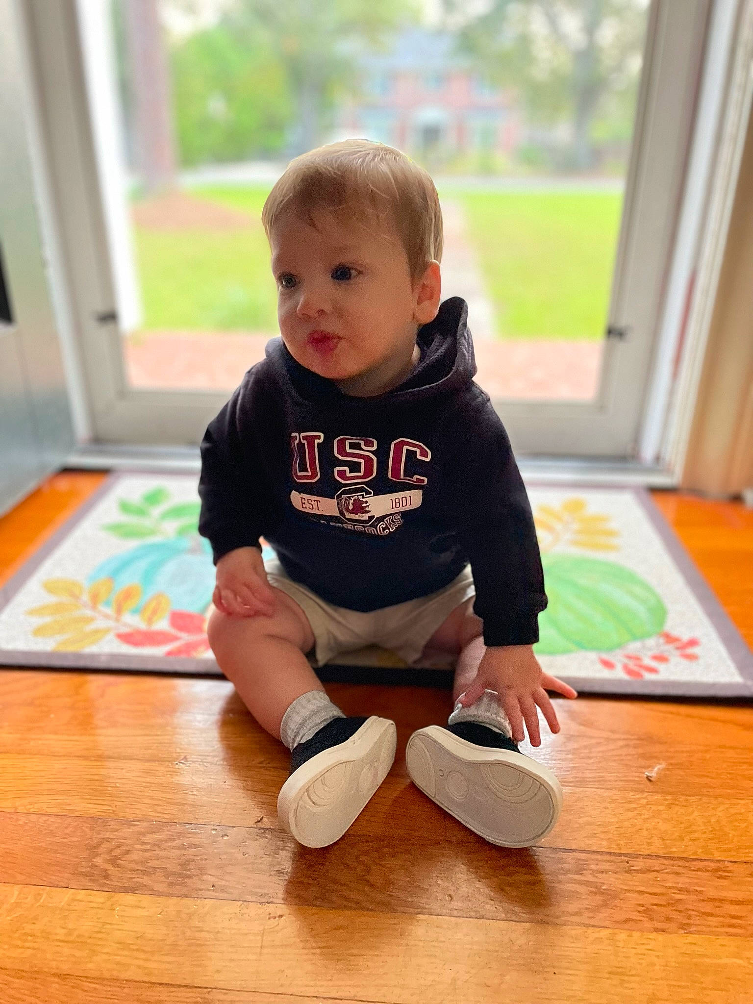 Raymond joined the competition — help win amazing prizes! baby, baby_toddler_clothing, child, floor, flooring, fun, happy, hardwood, human_leg, knee, person, shorts, sitting, skin, sleeve, standing, t_shirt, toddler, varnish, wood