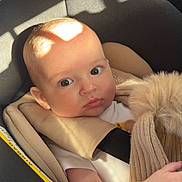 Vaelen joined the competition — help win amazing prizes! arm, baby, car_seat, child, clothing, comfort, cute, expression, face, indoor, infant, knit_hat, person, pom_pom, safety, seat, seat_belt, shadow, soft, sunlight