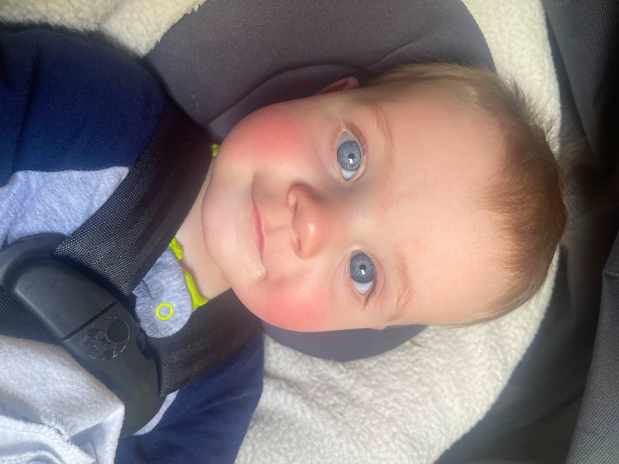 Archer is registered to the contest to win money with this photo: baby, baby_toddler_clothing, car_seat, cheek, child, comfort, eye, eyebrow, eyelash, flash_photography, forehead, iris, lip, mouth, nose, outerwear, person, skin, smile, toddler