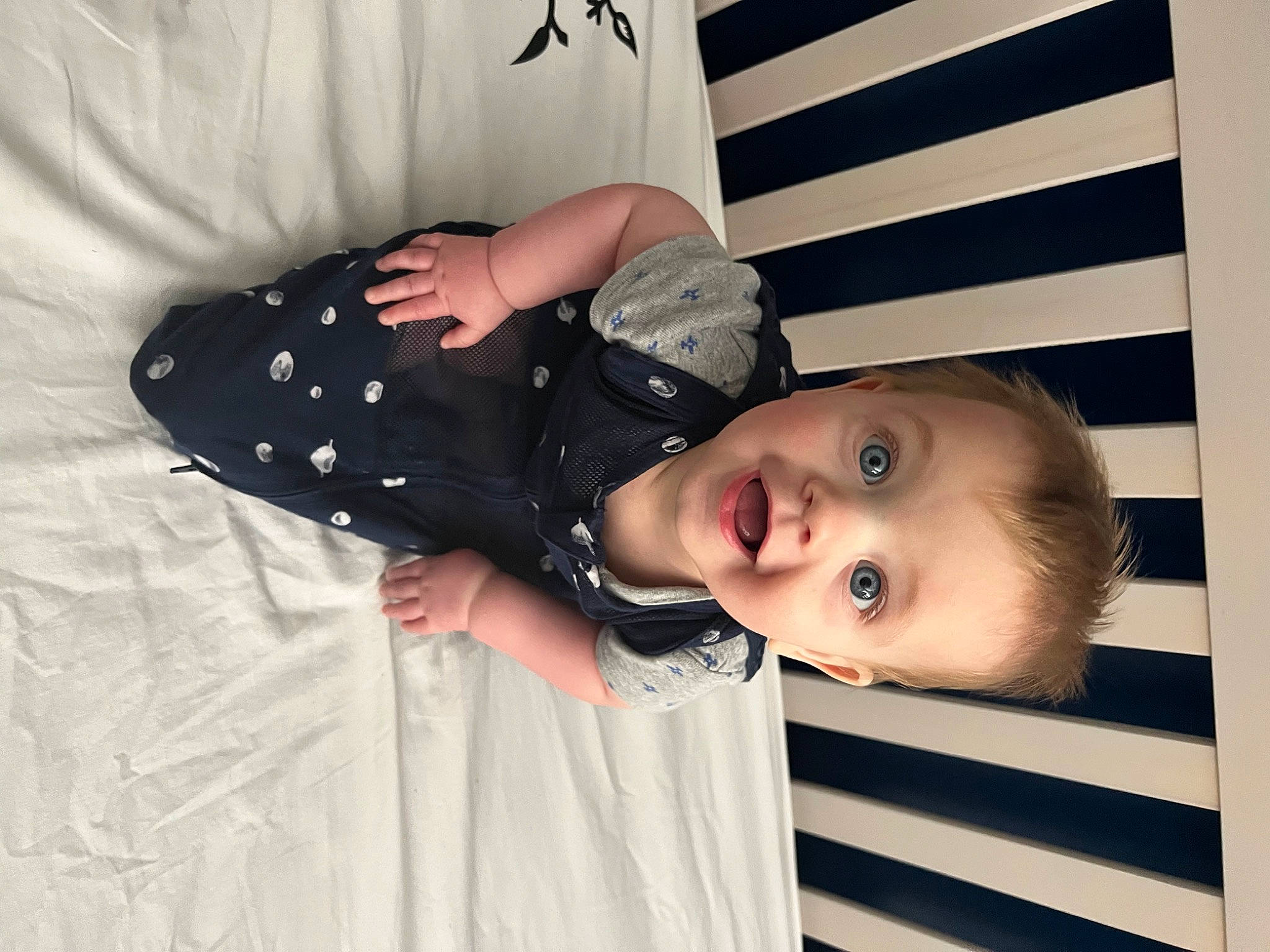 Archer is registered to the contest to win money with this photo: baby, baby_products, baby_safety, baby_toddler_clothing, cheek, child, collar, comfort, eyelash, fashion_accessory, happy, linens, pattern, person, room, skin, sleeve, smile, surprise, toddler