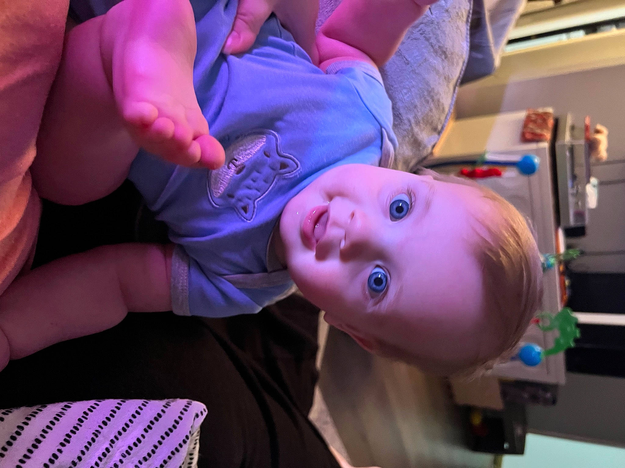 Archer is registered to the contest to win money with this photo: baby, cheek, child, comfort, electric_blue, eyelash, finger, fun, gesture, magenta, nail, nose, person, pink, purple, room, sitting, skin, toddler, violet