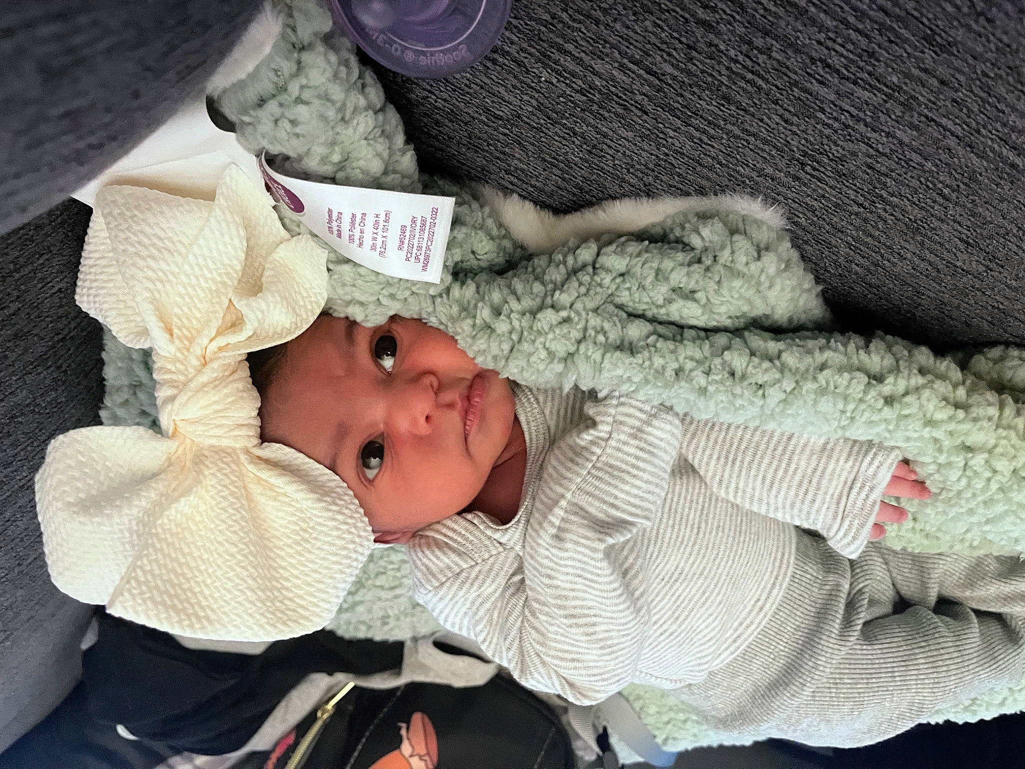 Nova is registered to the contest to win money with this photo: baby, baby_products, baby_sleeping, baby_toddler_clothing, bedtime, cheek, child, comfort, eye, hat, headwear, linens, nap, person, room, sitting, sleep, sleeve, smile, toddler