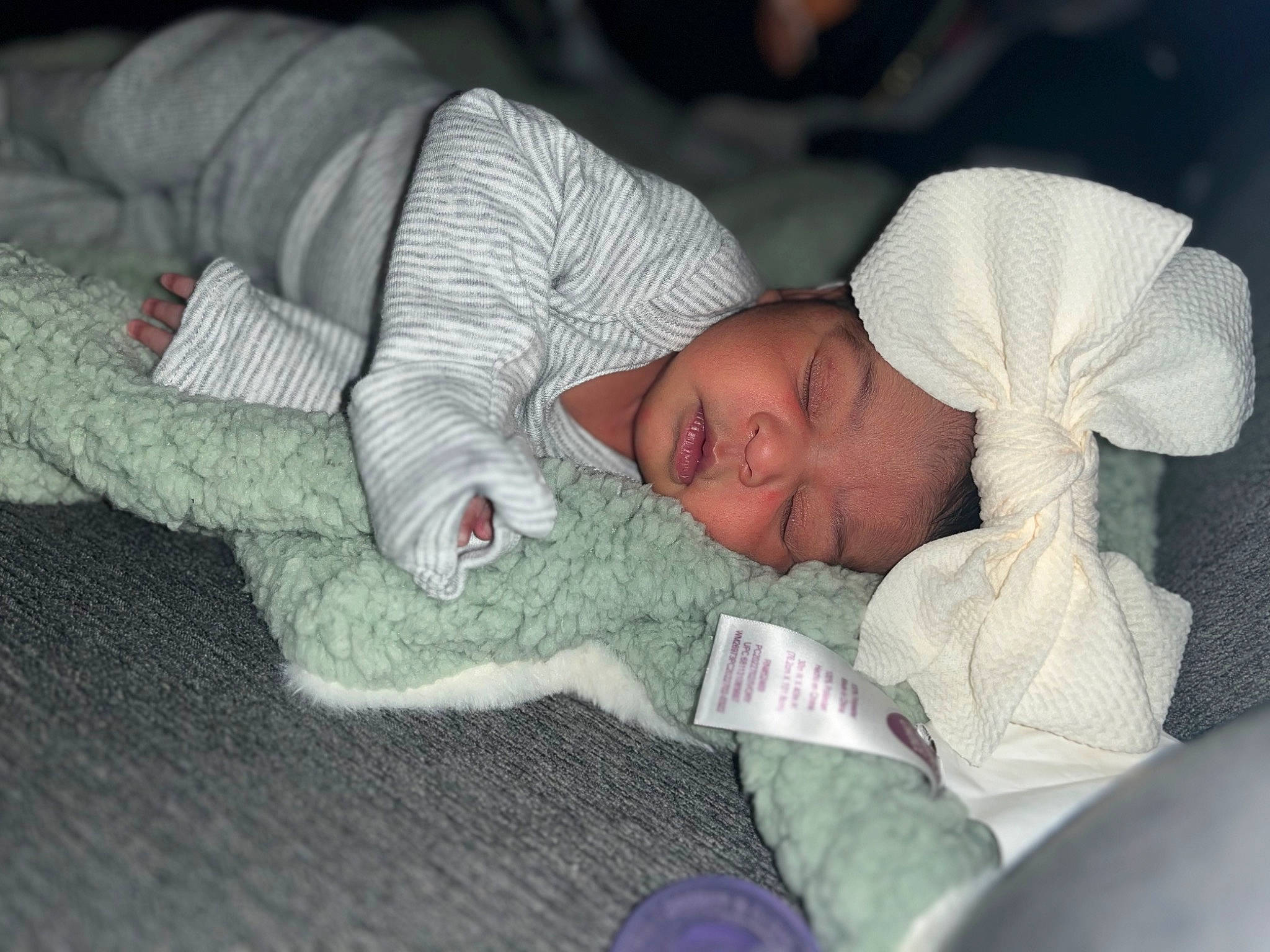 Nova is registered to the contest to win money with this photo: baby, baby_products, baby_sleeping, bedtime, child, comfort, headwear, linens, nap, person, room, sleep, toddler, tree, wool