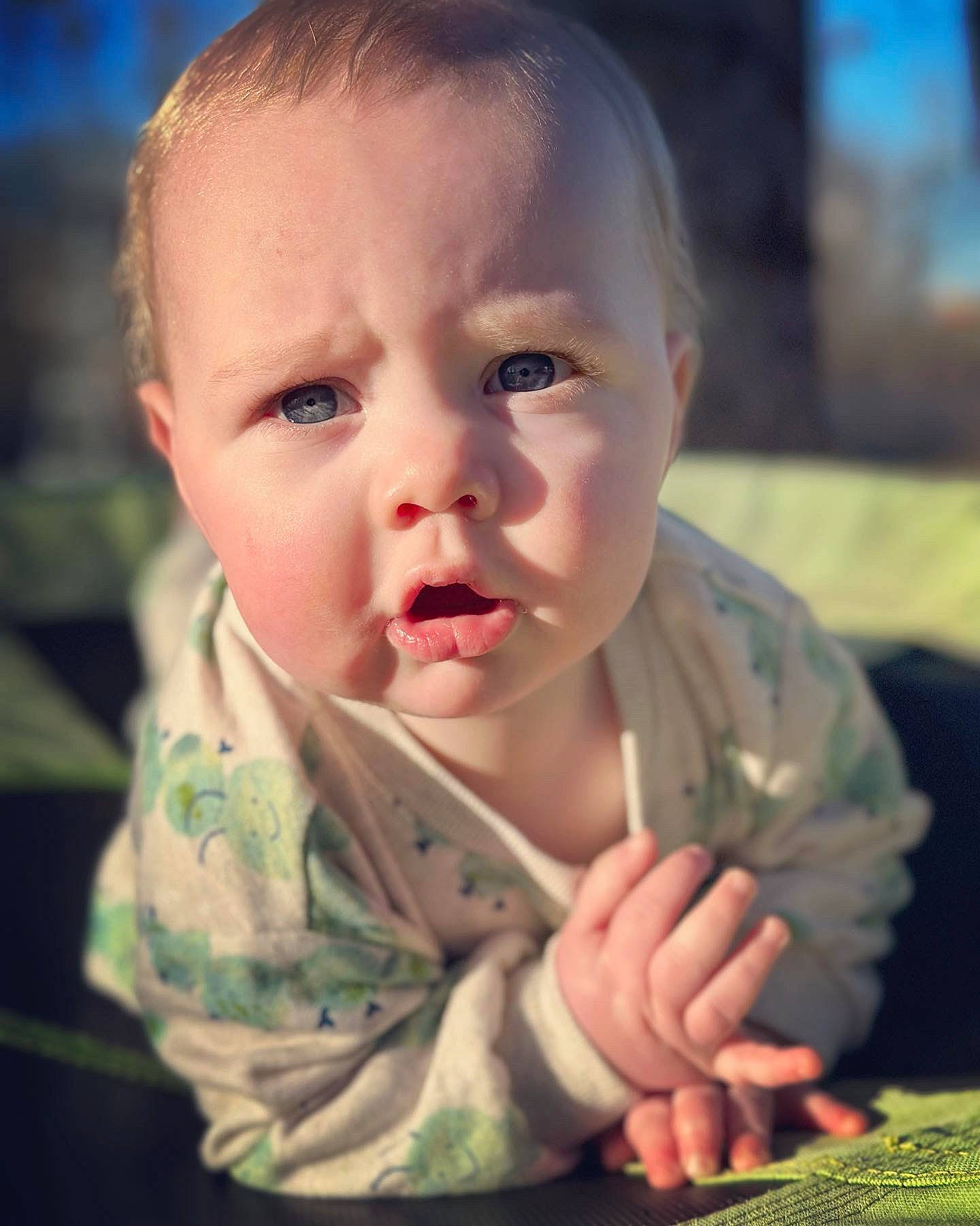 Jc is registered to the contest to win money with this photo: baby, baby_toddler_clothing, cheek, child, chin, close_up, comfort, ear, flash_photography, fun, gesture, grass, happy, iris, lip, mouth, nose, person, skin, sleeve