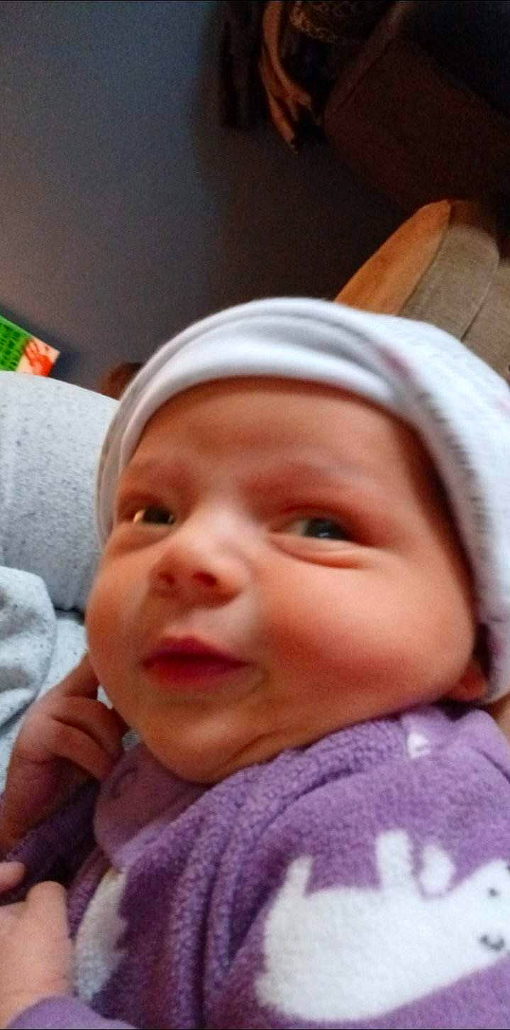 Daisy Mae is registered to the contest to win money with this photo: baby, cheek, child, chin, comfort, ear, eyebrow, eyelash, finger, fun, happy, headwear, iris, lip, mouth, nose, person, pink, skin, sleeve