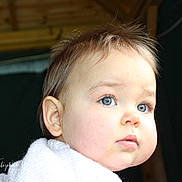 Harriet is registered to the contest to win money with this photo: baby, blanket, blue_eyes, child, close_up, cozy, cute, expression, eyelashes, face, hair, head, indoor, innocence, portrait, skin, soft_light, toddler, warmth, young