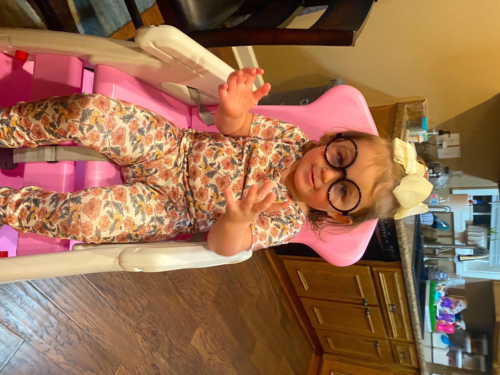 Evalyn is registered to the contest to win money with this photo: abdomen, drawer, eyewear, facial_expression, fashion_design, flooring, fun, hairstyle, hardwood, hat, human_leg, pattern, person, pink, shoulder, smile, thigh, trunk, waist, wood