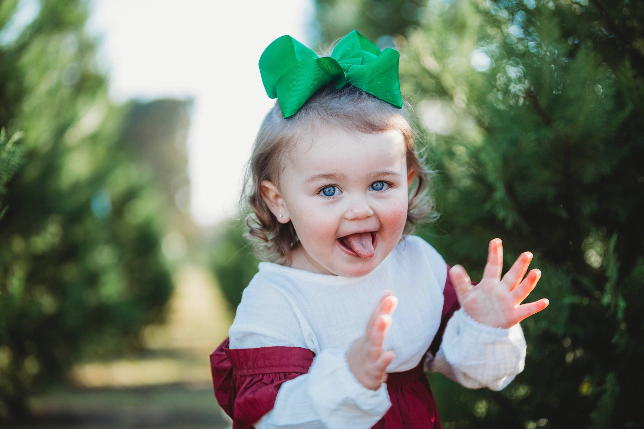 Evalyn is registered to the contest to win money with this photo: baby, baby_toddler_clothing, clothing, costume_hat, event, facial_expression, fun, gesture, grass, happy, head, leisure, party_supply, people_in_nature, person, pink, plant, recreation, smile, toddler