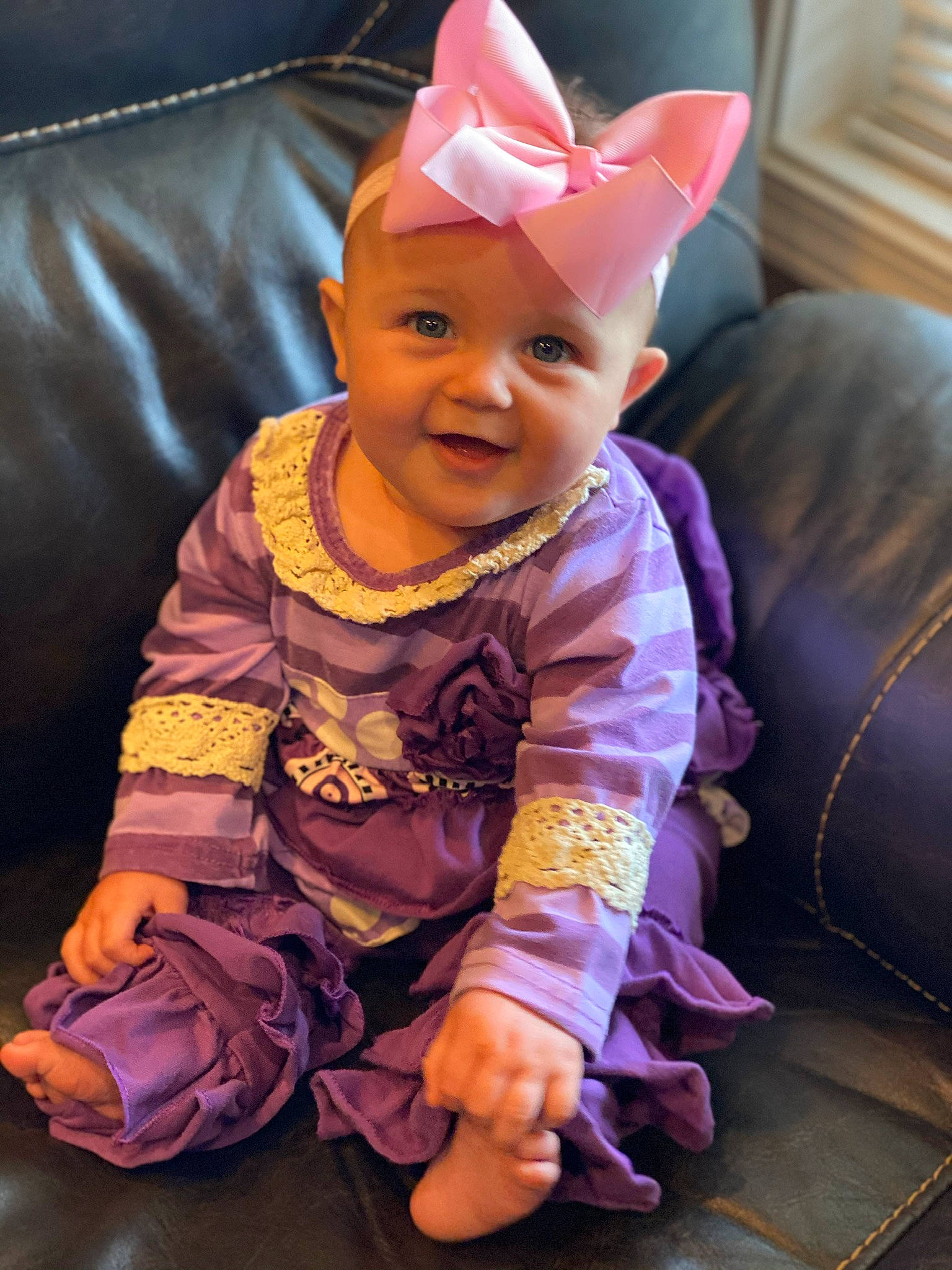 Evalyn joined the competition — help win amazing prizes! baby, child, ear, head, headgear, headwear, person, pink, purple, sitting, skin, smile, toddler