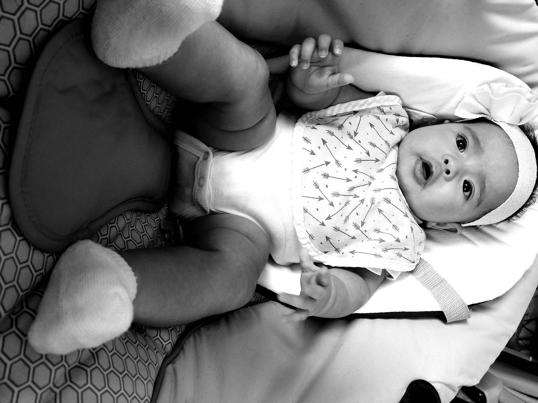 Emeri joined the competition — help win amazing prizes! abdomen, arm, baby, baby_toddler_clothing, black, black_and_white, comfort, elbow, finger, gesture, hand, headwear, knee, leg, mouth, muscle, person, photograph, style, thigh