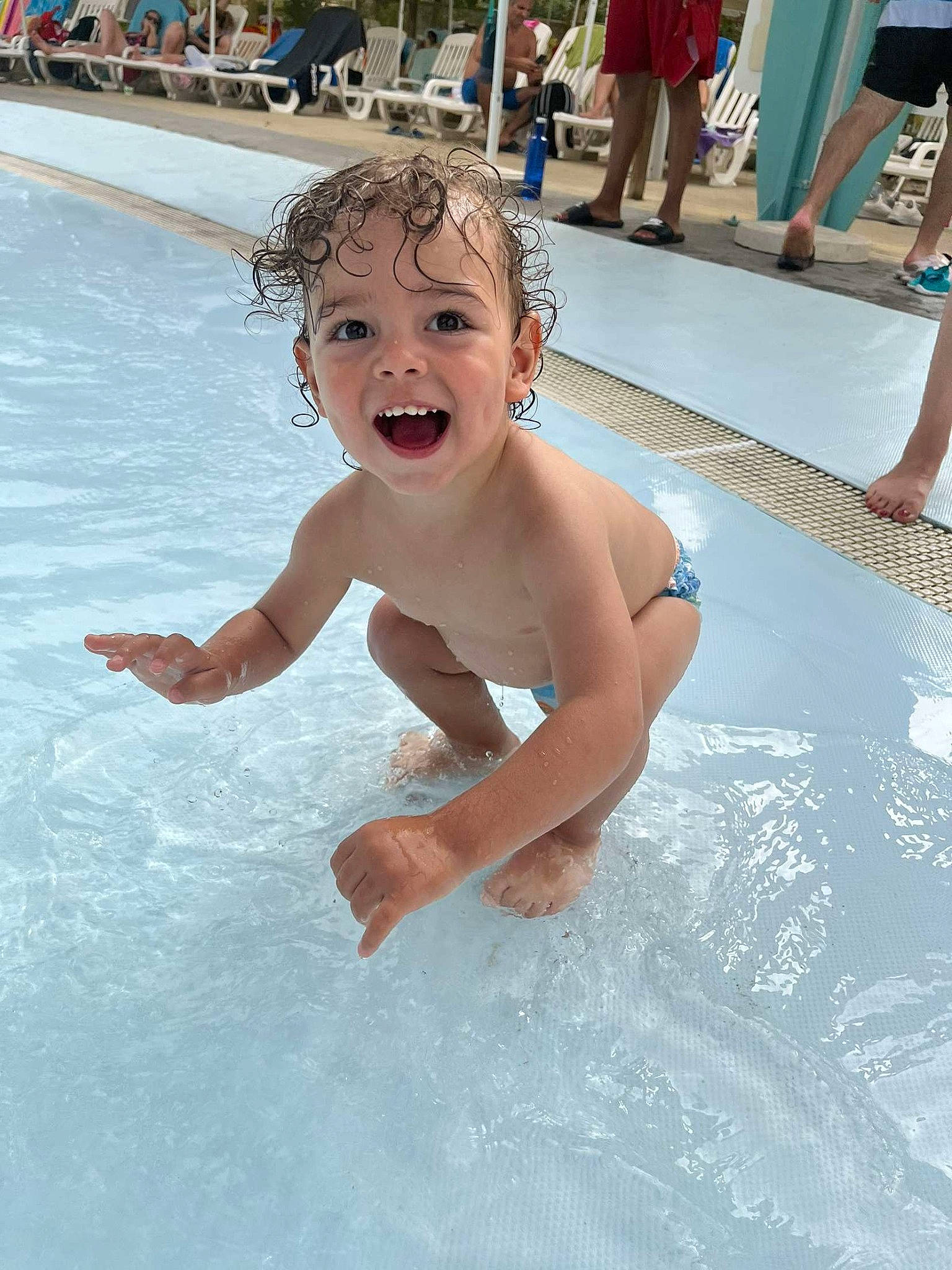 Kevin participe au concours pour gagner de l'argent avec cette photo : barechested, bathing, chest, event, fun, happy, leisure, leisure_centre, nonbuilding_structure, person, photograph, recreation, shorts, smile, summer, swimming_pool, swimwear, toddler, vacation, water