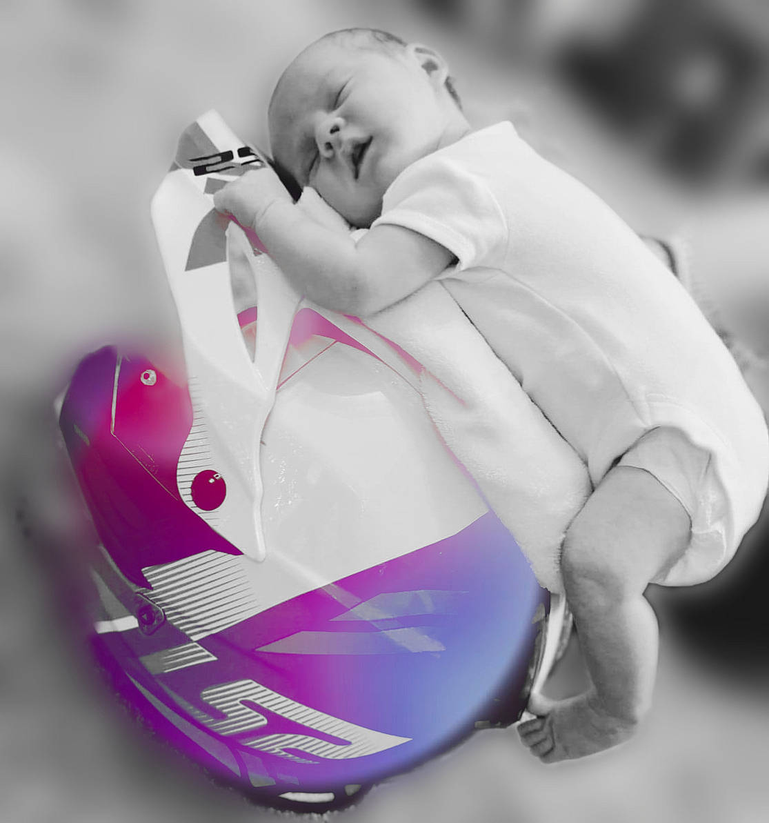 Travis is registered to the contest to win money with this photo: auto_part, automotive_design, automotive_wheel_system, baby, baby_carriage, baby_products, carmine, entertainment, fashion_accessory, font, gesture, happy, human_body, magenta, person, personal_protective_equipment, sitting, sleeve, sports_equipment, toddler