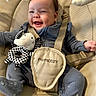baby, baby_boy, baby_girl, baby_seat, blue_clothing, child, comfort, cute, happy, indoor, infant, joy, moon_toy, plush_toy, portrait, seat, smiling, soft_toys, star_toy, straps