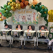 Eva Ayla Omar Abdull joined the competition — help win amazing prizes! children, babies, infants, high_chairs, birthday_party, balloons, balloon_arch, jungle_theme, animal_decorations, elephant, tiger, giraffe, wall_art, indoor, celebration, colorful, sitting, portrait, festive, nursery